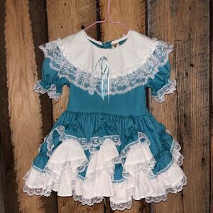 white strapless flowy dress Tea Length by Amoris T712W L / Off White Color:Black with Pink & Turquoise & Lilac Embroidery finished with a smocked ba&sh - Dress Omelia Spring Accessories